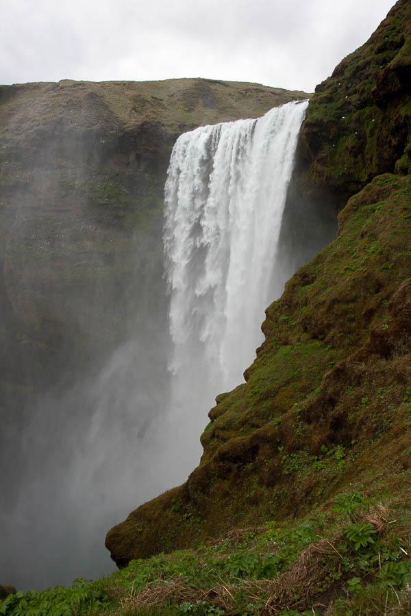 Hike to the top of the impressive Skogafoss waterfall for dramatic views of Iceland's South Coast. www.casualtravelist.com