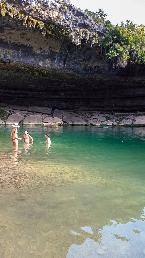 Swimmers taking a dip in Hamilton Pool in Texas Hill Country,, one of my favorite photos of 2015. www.casualtravelist.com