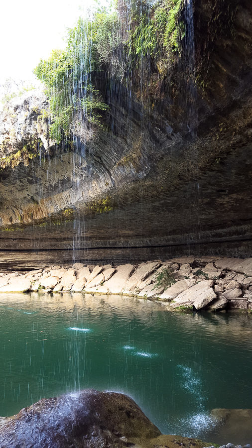 The beautiful emerald water of Hamilton Pool in Texas Hill Country is perfect for a swim. www.casualtravelist.com