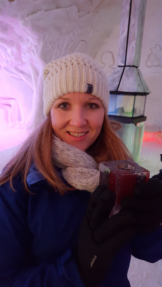 Enjoying a drink from the Ice Bar at the Hotel de Glace, Ice Hotel in Quebec www.casualtravelist.com