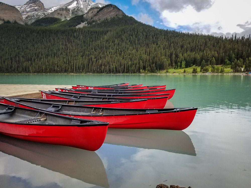 Canoes in Banff. Banff Travel Guide - Tips for your First Trip to Banff National Park www.casualtravelist.com
